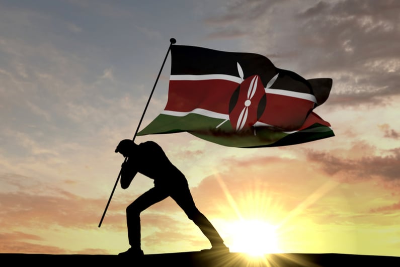 Flag of Kenya being planted in the ground