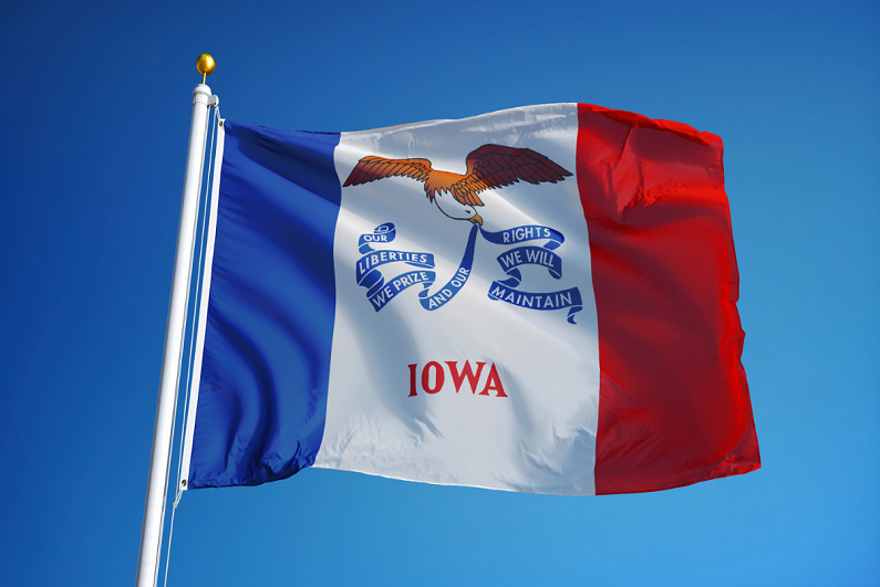 iowa-state-flag-waving-against-clear-blue-sky