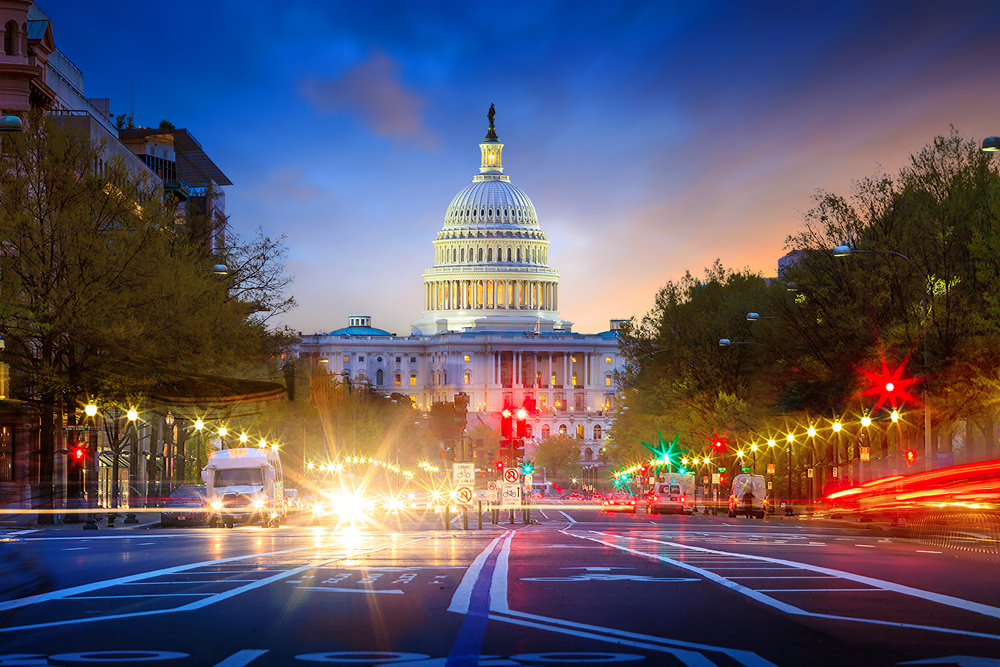 Illuminated city scene of Washington D.C. with the Capitol building in the background