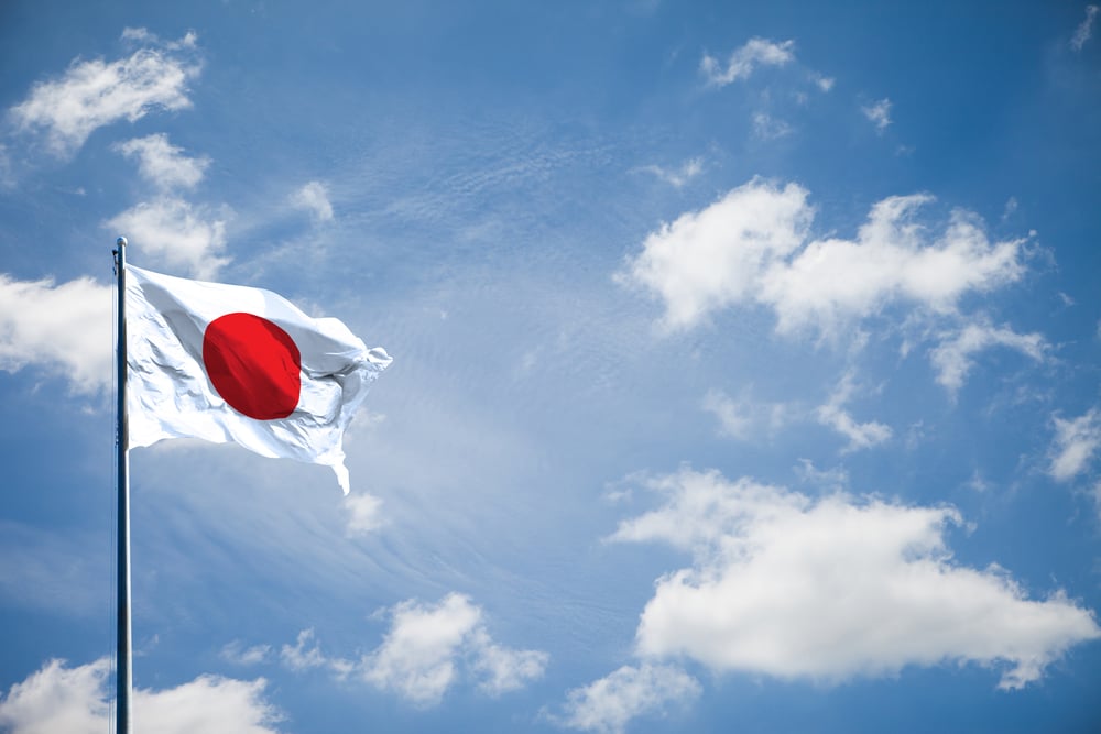 flag of Japan with sunny sky backdrop