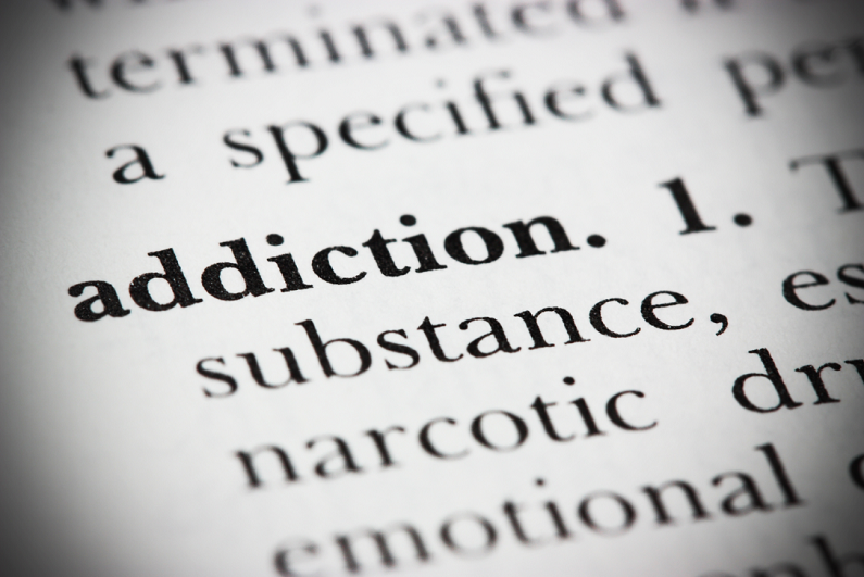 closeup of 'addiction' in dictionary