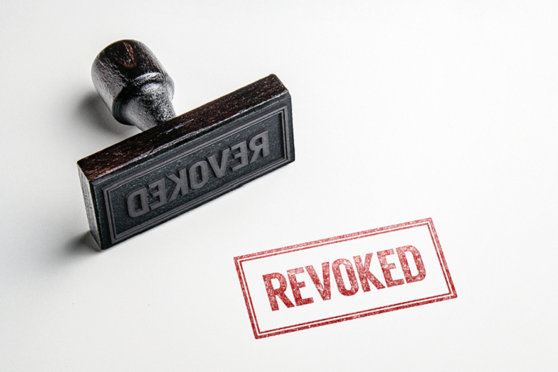 Rubber stamping that says 'Revoked'