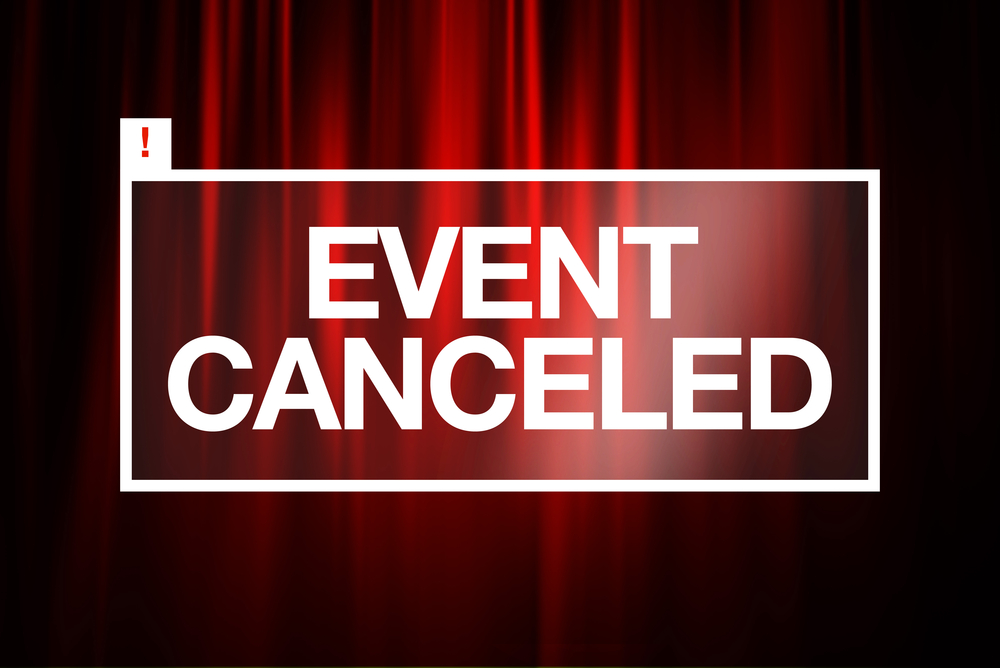 notice reading event canceled against a red curtain backdrop