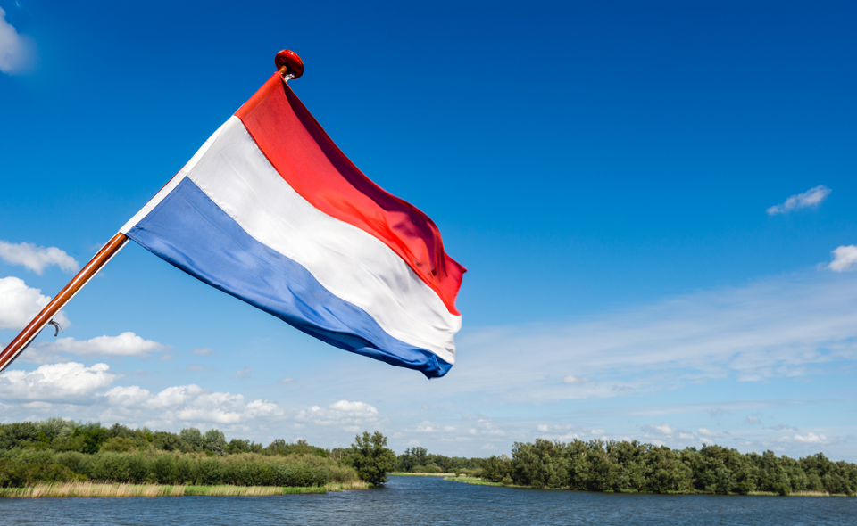 Dutch flag waving on the stern of a tour boat