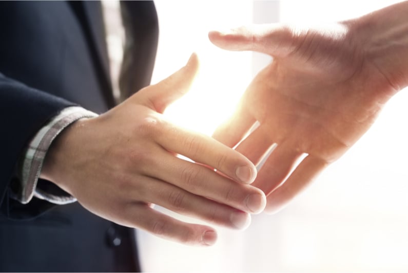 two people shaking hands