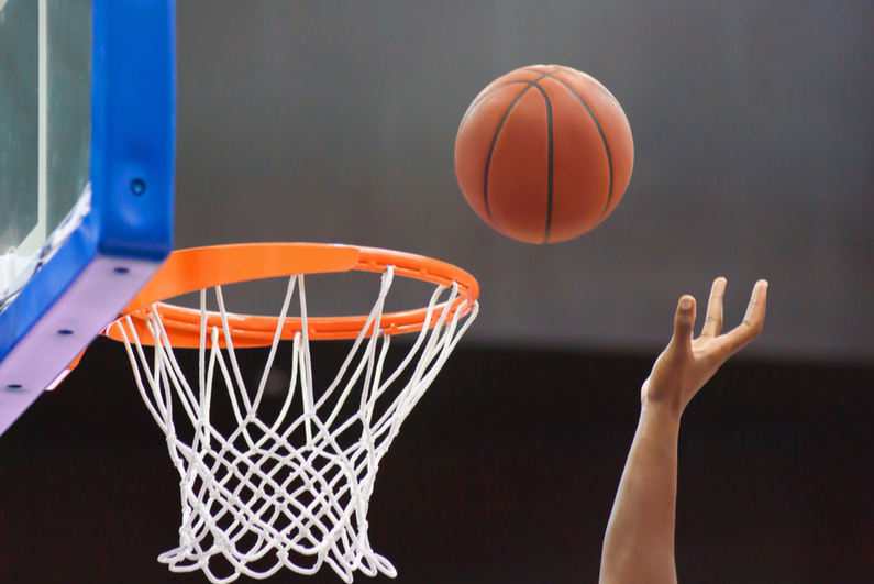 basketball player going for a tip-in