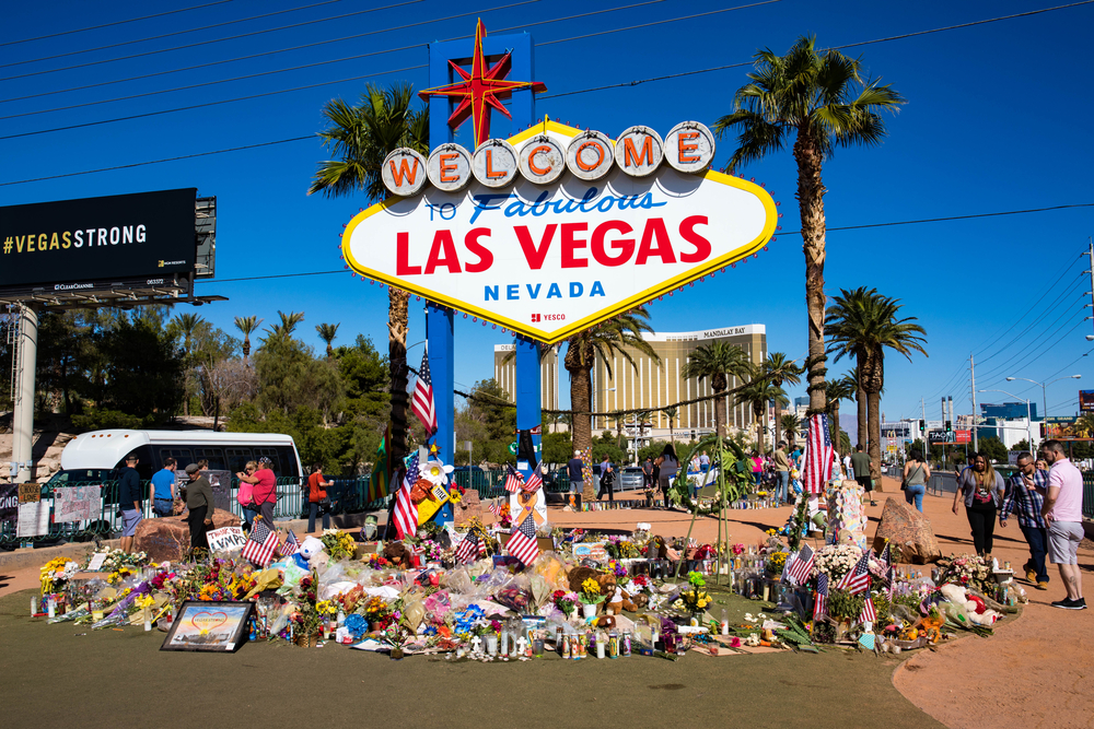 Las Vegas sign with flowers for victims of 2017 shooting