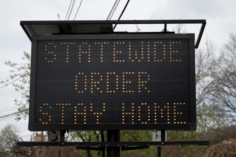 Electronic road sign reading, "Statewide order stay home"