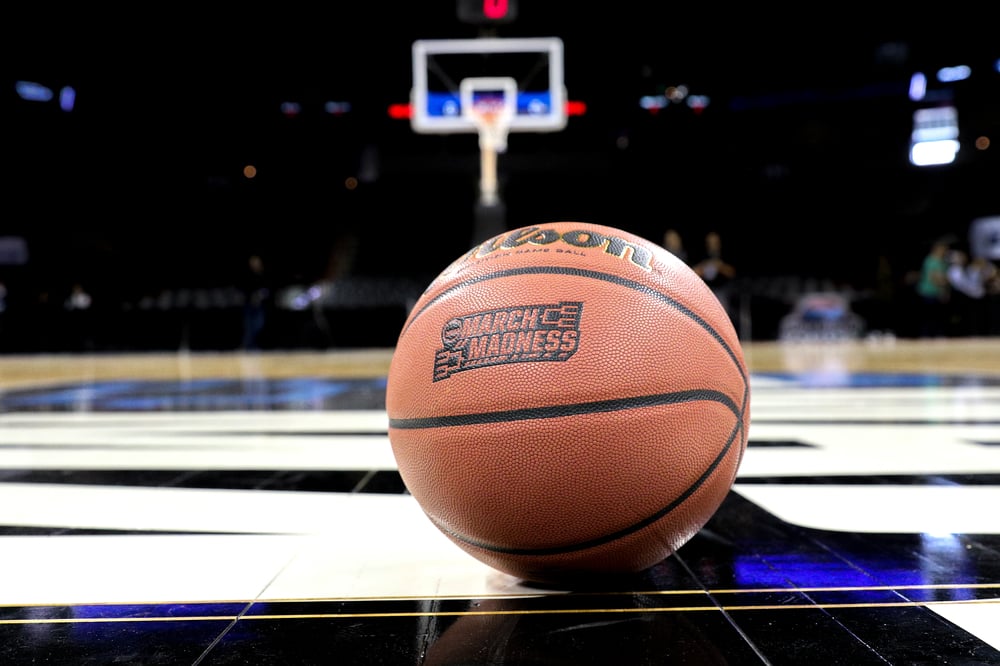 March Madness basketball on court