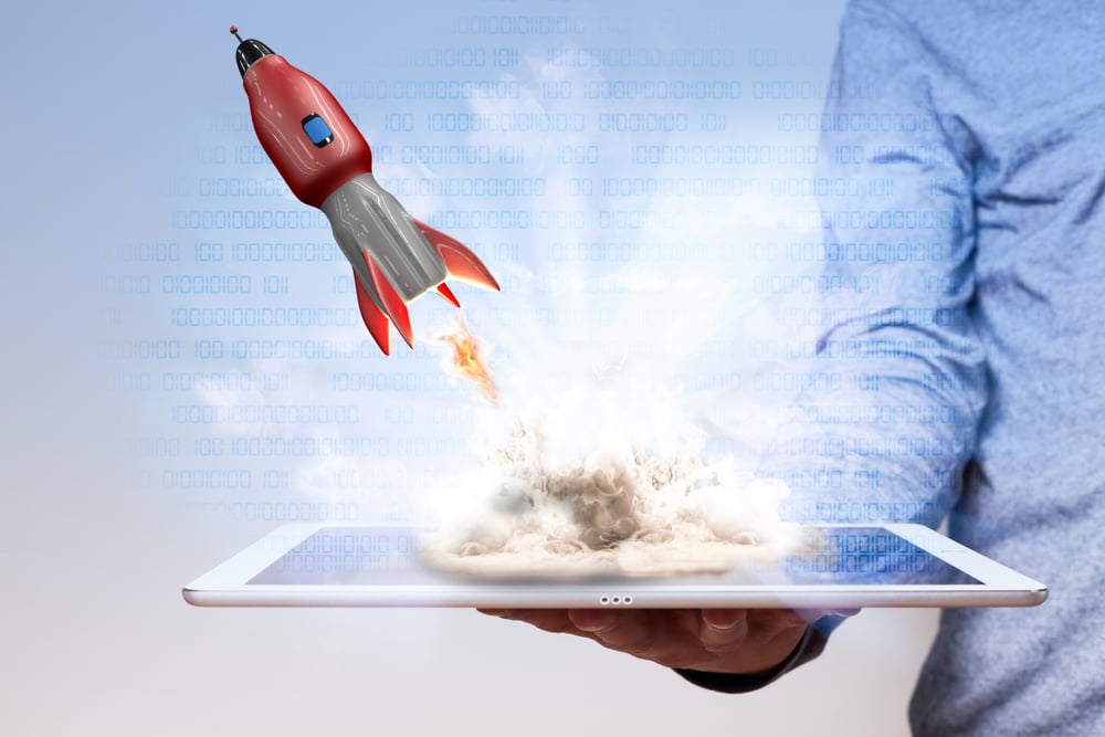 rocket launching out of a tablet