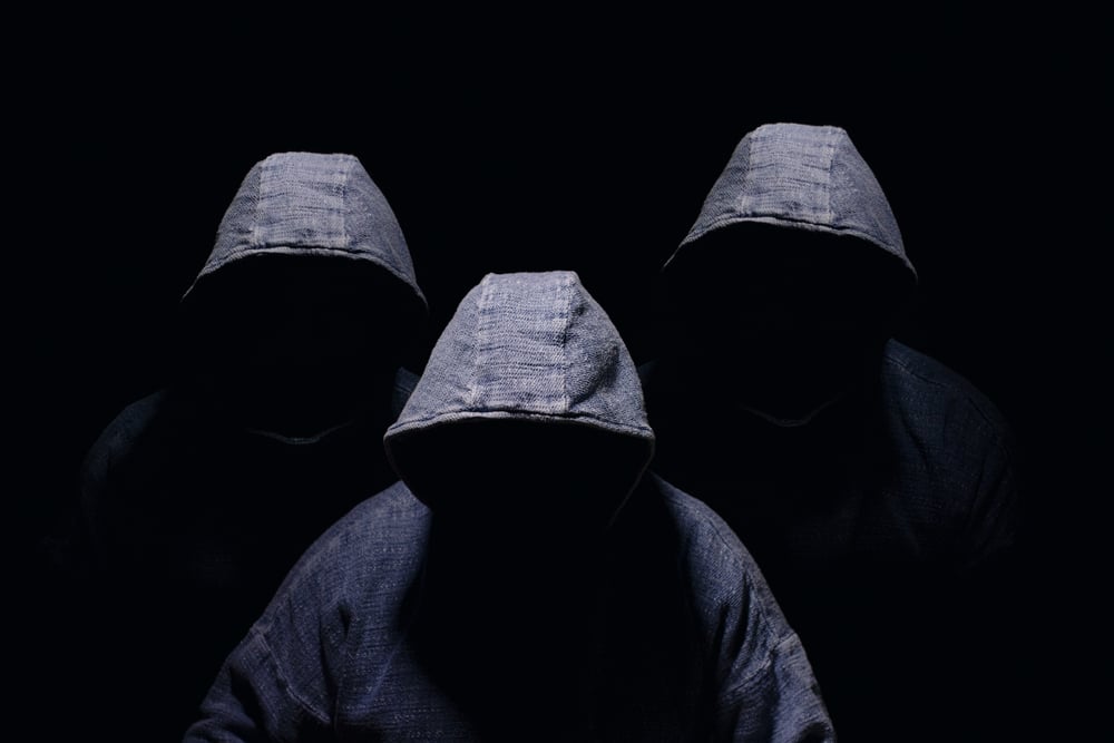 three hooded men