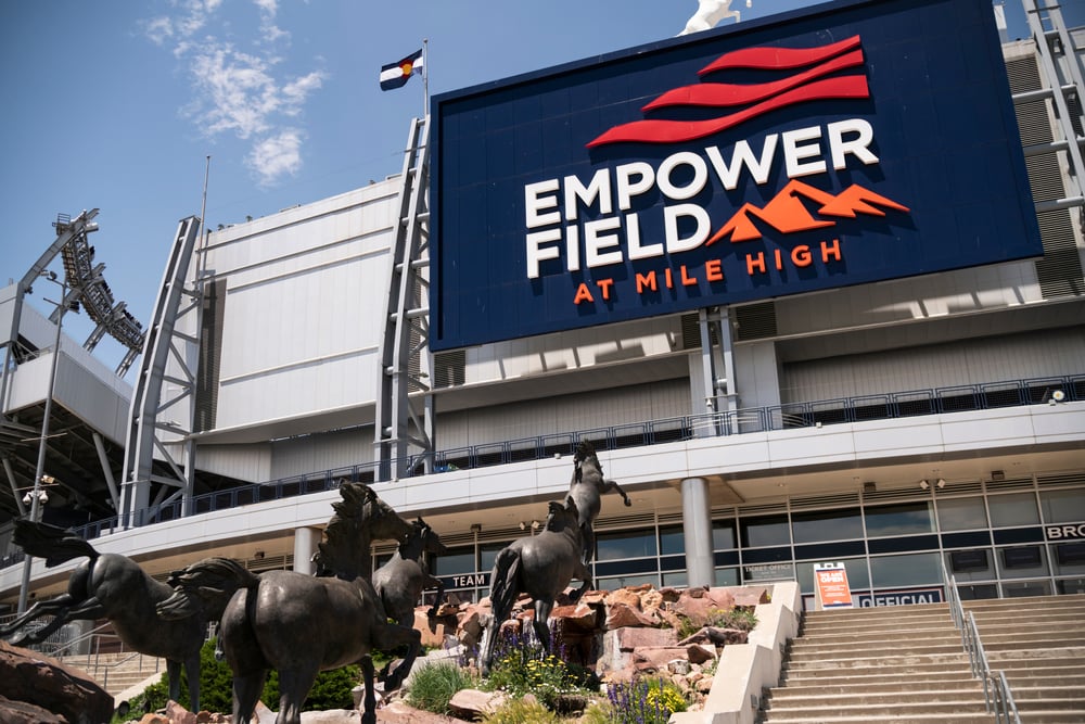 Empower Field at Mile High Stadium with charging Broncos statues