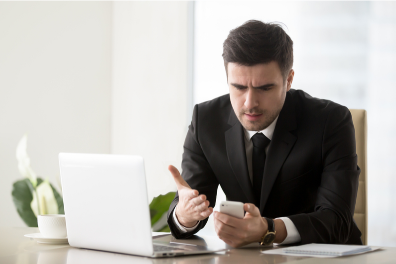 man frustrated with phone